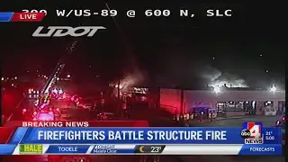 Firefighters battle structure fire dangerously close to gas station
