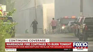 Firefighters continue to battle warehouse fire