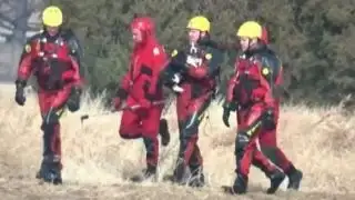 Firefighters rescue dog stranded on icy lake
