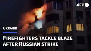 Firefighters respond after Russian strike hits building in Kyiv | AFP
