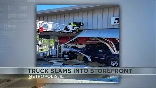 Firefighters stabilize building and rescue driver after crash