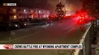 Firefighters work to put out Wyoming apartment fire