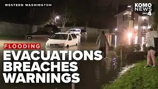 Flash flood warnings, levee failures, and evacuations continue