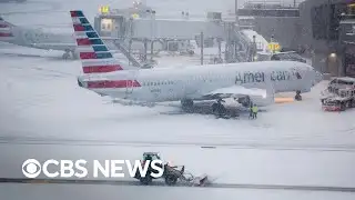 Flight cancellations pile up across the country amid major winter storms