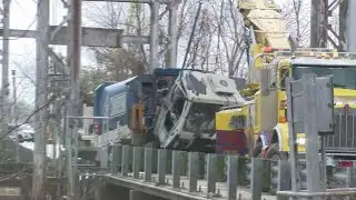 Garbage truck crash shuts down Estherwood Pontoon Bridge for hours; driver cited