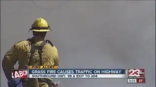 Grass fire causes traffic on Highway 99
