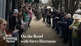Hundreds form a human chain to move a Michigan bookstore by hand