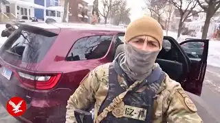 ICE agent confronts angry protesters in Minneapolis