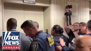 ICE faces protesters, angry lawmakers: 11 Democrats arrested