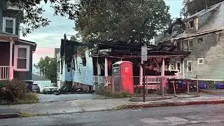 Intense flames damage adjacent homes as fire destroys house