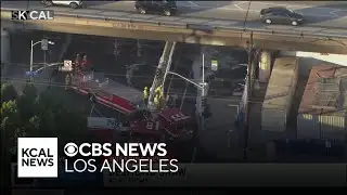 LAFD crews quickly extinguish fire burning underneath 10 Freeway overpass