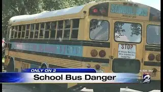 Locks on school bus emergency exit doors
