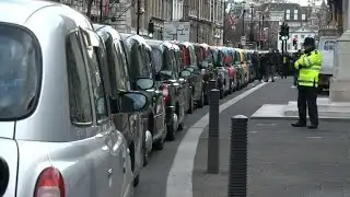 London black cab drivers block streets in Uber demo