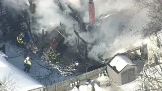 Lowell crews battle two-alarm house fire, heavy smoke