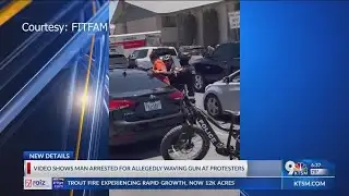 Man arrested for allegedly waving gun at protesters