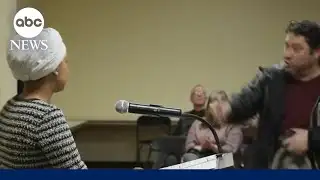 Man charges toward Rep. Ilhan Omar during town hall