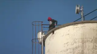 Man Climbs Down Grain Elevator following Onawa Fires