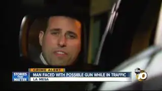 Man faced with possible gun while in traffic