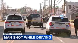 Man shot while driving tow truck; suspect at large