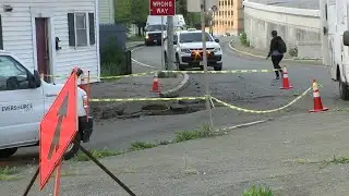 Manhole explosion shatters windows