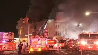 Massive flames rip through apartment building in Queens
