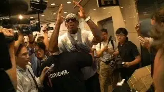 Media frenzy greets Dennis Rodman