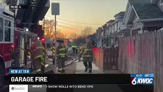 Moline firefighters battle garage fire and wind
