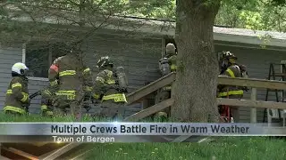 Multiple crews battle fire on warm day