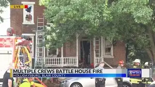 Multiple crews battle house fire