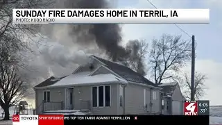 Multiple fire crews contend with frigid temperatures while battling Dickinson County house fire