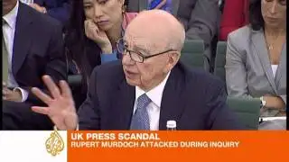 Murdoch denies blame for hacking scandal