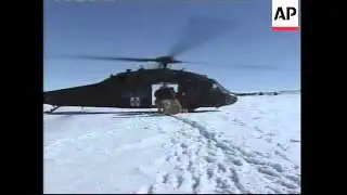 National Guard attempt to feed cattle stranded by blizzards