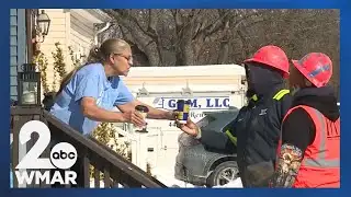 Neighbor gives hot drinks to crews working on Dundalk watermain break