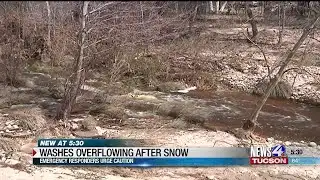 Officials urge caution as washes start to overflow