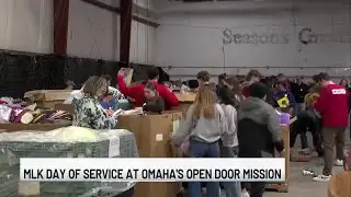 Omaha neighbors lend a helping hand sorting through toys at Open Door Mission