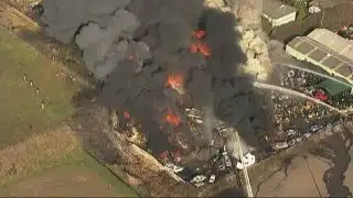 One year since huge salvage yard fire