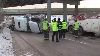 Overturned semi closes I-490 E. ramp