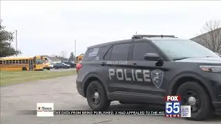 Parents anxiously wait for children during school evacuation