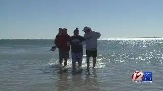 Participants brave the chilly wind, freezing water for Special Olympics RI