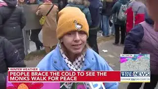 People brave frigid air to see monks