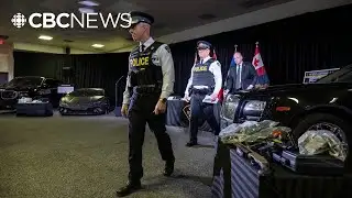 Police arrest 20 in major auto theft investigation