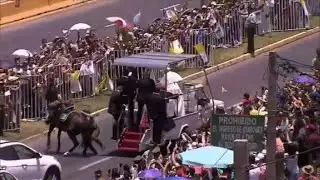 Pope breaks protocol and attends to fallen policewoman on horse