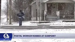 Postal worker robbed at gunpoint