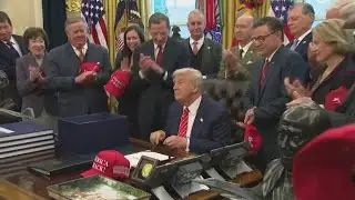 President Donald Trump signs massive funding bill to end 3-day government shutdown