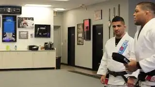Professor Ronaldo Candido receiving his second degree from André Galvão