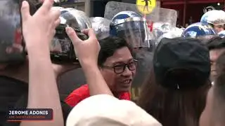 Progressive groups try to get through police barricade in Labor Day gathering