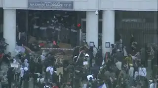 Protesters seen throwing objects at police during Los Angeles 