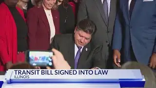 QCA leaders join Illinois Gov. Pritzker as he signs Transit Bill