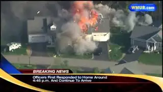Raw video: Explosion rocks home after officer shot