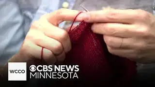 Red knitted hats being used as a quiet protest of ICE